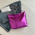 Metallic purple tote bag with golden chain strap on stylish denim background layout - Purple