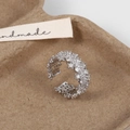 Detailed close-up of wide silver ring with micro-pave zircons and lace edges - Silver
