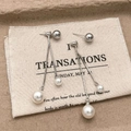 Detail of silver tassel earrings with champagne pearls and long snake bone chains - White Pearl Tassel Stud Earrings