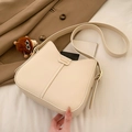 Minimalist beige leather shoulder bag with gold letter printing and plush pendant - With Pendant / Off-white