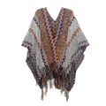 Close-up of geometric knit pattern and fringe hem on bohemian style poncho - Grey