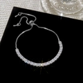 Macro shot of silver tennis bracelet with square-cut zircons and adjustable slider clasp - Sparkling Square Zirconia Splicing Adjustable Bracelet