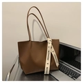 Large dark brown leather tote bag with fashion lettered strap on metal shelf - Brown