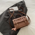 Brown vintage messenger backpack with heart embossing and decorative double bows - Brown