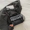 Black vintage leather messenger bag with heart bow and silver studs on flap - Black