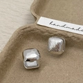 Macro detail of silver square hoop earrings featuring hammered and vertical stripe textures - Geometric Square Silver Earrings