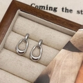 Minimalist glossy silver oval hoop earrings displayed in a premium velvet jewelry box - Silver Linked Hoop Earrings