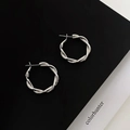 Detailed view of silver twisted rope hoop earrings with intricate metallic texture - Silver Spiral Crossover Earrings