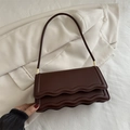Deep brown crossbody bag with unique double wave flap design and gold hardware detail - Brown