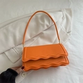 Fashionable bright orange square shoulder bag featuring trendy double-layered wavy edge flap - Orange