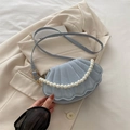 Light blue shell-shaped crossbody bag with quilted scallop pattern and faux pearl chain - Blue