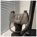 Detail of vintage hobo bag with metallic bow, pearl chain and brown leather trim - Gray