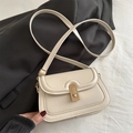 Minimalist creamy white leather crossbody bag featuring a golden twist lock closure - White