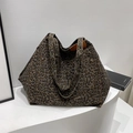 Stylish large leopard print canvas tote bag with front pocket and dual top handles - Black