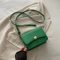 Chic green leather baguette bag with golden metal buckle and adjustable strap - Green