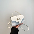 White mini crossbody bag with crocodile embossing and golden buckle detail - White