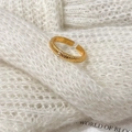 Macro detail of gold vintage ribbed ring with three small zircons on knit background - C-371 Narrow Texture Style (5649717584093) / Gold