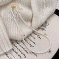 Elegant white pearl necklace with colorful floral pendants on soft knit background - White Pearl Flower Style (B-481-施家珍珠)