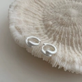Detailed macro view of matte silver interlocking hoop earrings with textured finish - Matte Silver Style (2313)
