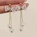 Elegant gold bow pearl long tassel earrings featuring floral petal pendants for women - Gold