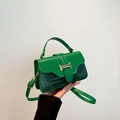 Green leather crossbody bag with crocodile texture and golden metal buckle details - Green