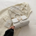 Creamy white square handbag with gold buckle and matching coin purse on beige blazer - White