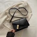 Classic black crossbody bag with geometric flap and golden rectangular twist lock - Black