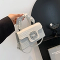 White faux crocodile skin handbag with pleated handle and sparkling rhinestone buckle - White