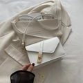 Minimalist white leather crossbody bag with elegant golden rectangular twist lock design - White