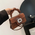 Brown crocodile pattern handbag with rhinestone buckle and pleated handle detail - Brown