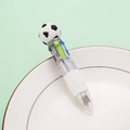 Multi-color retractable ballpoint pen with soccer topper on a white plate - Black Soccer Style