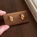 Macro detail of matte gold irregular pleated flower stud earrings with a wavy texture - Small Flower (Gold) / Matte Gold