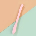 Pink silicone flying broom gel pen with soft-touch grip on a color-blocked background - Broom Style / Pink