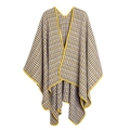 Detail of yellow-edged houndstooth knit shawl with classic black and white patterns - Yellow