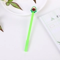 Cute green avocado gel pen with a 3D silicone cartoon topper on a minimalist desk - Pointed Avocado