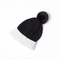 Detail of kids knit beanie with black body and contrast white ribbed brim with pom-pom - Hat Black and White