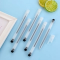 Frosted transparent gel pens with black ink and pen clips on a light blue background - Matte Transparent With Black Cap