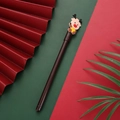 Brown Christmas reindeer retractable gel pen with festive red and green background - Brown Reindeer