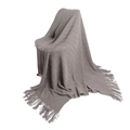 Grey knitted blanket with diamond weave pattern, textured pom-poms, and long tassels - Smoke