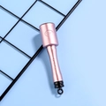 Close-up of metallic pink massage hammer with ergonomic handle and hanging hook - Pink