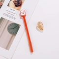 Creative orange gel pen with cute toast silicon topper featuring heart eyes on a white desk - Toast Bread