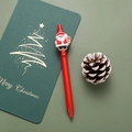 Red Christmas gel pen with a 3D Santa Claus clip on a festive green notebook - Santa Claus / Red