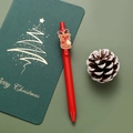 Red Christmas gel pen featuring a 3D reindeer charm on a festive green background - Reindeer / Red