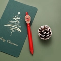 Red Christmas gel pen featuring a cute 3D gingerbread man charm on the clip - Gingerbread Man / Red