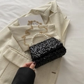 Elegant black sequin evening bag featuring a pearl handle and gold chain shoulder strap - Black