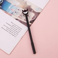 Black devil neutral pen with red eyes and toothy cartoon topper on pink background - Red-Eyed Little Devil / 0.5mm