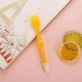 Creative bright yellow skeleton-shaped ballpoint pen on pink background with stationery - Open Hand Gesture / Yellow