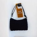 Minimalist black bubble textured shoulder bag with chic knot strap and silver zipper - Black