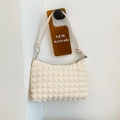 Chic creamy white bubble textured baguette bag with knotted shoulder strap detail - Off White