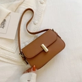 Minimalist brown crossbody square bag with a sleek gold buckle on soft white fabric - Brown